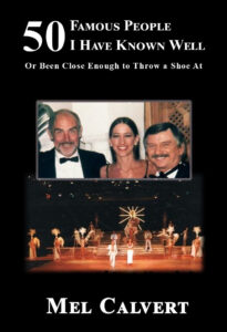 A group of people standing on stage with a man and woman.