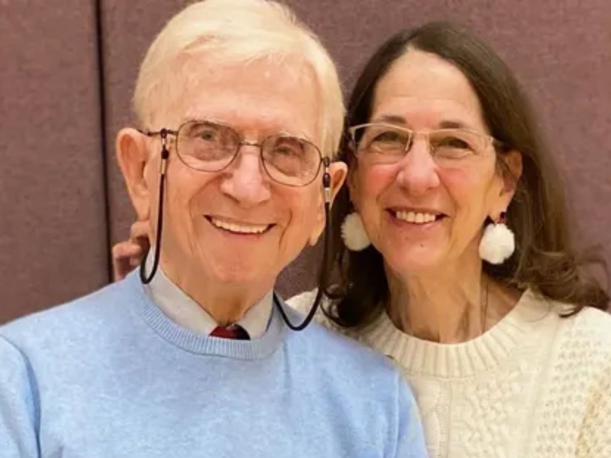 A man and woman standing next to each other.