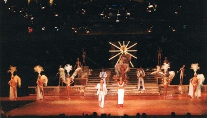 A group of people standing on top of a stage.